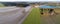 Aerial landscape view, aerial photo with a lake, fields, meadows, forests and a road, panorama as banner for a blog or website