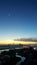 Aerial landscape view of cityscape while dawn breaking with beautiful hues with star and moon still in sight