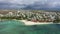 Aerial Landscape view of Flic en Flac beach with cityscape of Flic en Flac town and Mauritius mountain landscape in the background