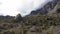 Aerial landscape view of green rocky canyon mountains with sunset sky with peaks with grass tropical