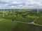 Aerial landscape view of group of windmills in a wind farm creating renewable energy at  Nakhon Ratchasima, Thailand