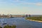 Aerial landscape view of Kyiv at summer sunny day. Beautiful Dnipro River with bridges and Obolon district at the background.