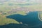 Aerial landscape view of village fields and lake