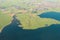 Aerial landscape view of village fields and lake