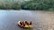 Aerial landscape view of whitewater rafting boat crew rafting on river