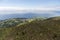 Aerial landscape views on green hills, pastures and the ocean as seen from Lagoa do Fogo Lake/ Lagoon of Fire in direction to