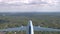 AERIAL Large freight plane flying over forest covering the outskirts of New York