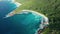 Aerial lift up over harbor Anse Cocos beach, La Digue, Seychelles