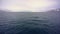 Aerial-like shot of the sea from a boat in Akureyri, Iceland