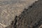 Aerial like view from the top of the Marsous volcano crater covered in jasper, down to the lower debris streams