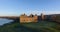 Aerial: Linlithgow Palace beside Linlithgow Loch, Scotland