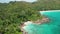 Aerial lock down over Petite Anse Lazio beach, Praslin, Seychelles