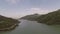 aerial long lake and mountains, blue sky