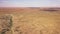 Aerial of a long road running through a desert landscape, Kalahari