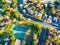 Aerial Looking down over Modern Austin Texas Countryside Community Suburbia Neighborhood with Tennis Courts and Recreational Area