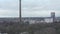 Aerial: low shot over Germany City Cologne with view of TV Tower on Cloudy Day