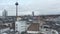 AERIAL: Low Shot over Germany City Cologne with view of TV Tower on Cloudy Day