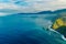 Aerial Madeira island view with Atlantic ocean, white waves, cliffs and green nature