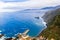 Aerial Madeira island view with Atlantic ocean, white waves, cliffs, and green nature