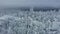 Aerial: man stands on mountain peak and enjoys panoramic view Northern landscape