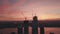 AERIAL: Manhattan, New York City High Rise Construction Site Crane in Red Dawn Sunset Light