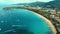 Aerial: Many boats near the beach.