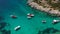 Aerial mediterranean sea landscape with sailing boat, yachts, turquoise clear water and bay coastline
