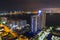 Aerial Miami Beach condominiums at night port in background