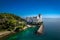 An aerial of the Miramare Castle in the scenic Gulf of Trieste in Italy captured on a bright day