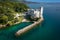 An aerial of the Miramare Castle in the scenic Gulf of Trieste in Italy captured on a bright day