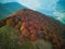 Aerial of Monte Galbiga mountain of Lombardy covered in autumn foliage, fall colors in Italy
