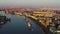 Aerial morning cityscape with warships in the waters of the Neva River before the holiday of the Russian Navy at sunrise