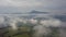 Aerial morning mountains view in the fog in the Low Tatras with city on background