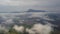 Aerial morning mountains view in the fog in the Low Tatras with city on background