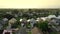 Aerial morning video residential neighborhood with two story homes painted colors