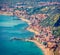 Aerial morning view of Villagonia town, Province of Messina. Stunning summer seascape of Mediterranean sea. Splendid view of Sicil