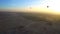 Aerial motion video riding hot air balloon over Luxor Egypt valley of the king Unesco heritage site sunrise