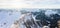 Aerial mountain panorama with a snowy rocky mountain ridge