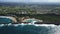 Aerial Moving Into Secluded Beach Shaped By Unique Rock Formation