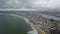 Aerial Moving Toward Massive Slum on Beach