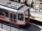 Aerial of MUNI train at King street station people board it outside AT&T Park