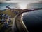 Aerial Newfoundland coastline peninsula with sandy shores and beach homes along the Atlantic East Coast of Canada