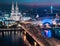 Aerial night panorama of the illuminated Hohenzollern bridge over Rhine river. Beautiful cityscape of Cologne, Germany