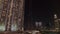 Aerial night shot of Downtown Dubai. Glittering modern office buildings next to Burj Khalifa