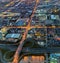 Aerial night view of a complex traffic interchange and city neighborhoods layout somewhere in Canada