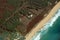 Aerial of Northwest coast beach of Molokai with waves crashing i