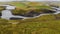 Aerial of an old bridge that leads over the Thjorsa river in Iceland