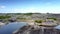 Aerial old clay quarry with lakes islands and flying birds