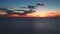 Aerial orange sunset over sea. Evening dramatic sky over blue ocean. Cinematic drone flight water