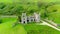 Aerial orbit view of Clifden Castle, Connemara Co. Galway, Ireland.